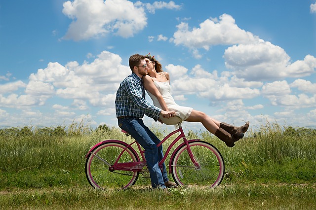 romantic couple on bicycle