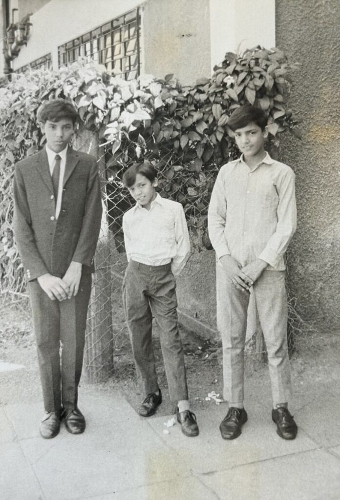 Childhood photograph of Arvind Devalia standing between his two brothers in Kenya.